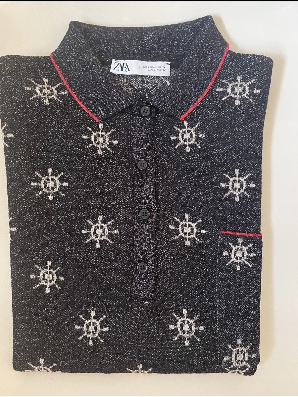 Zara Black Metallic Knit Polo with White Wheel Motifs and Red Trim